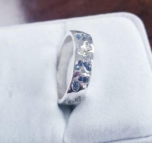 Beautiful Sterling Silver 925 band with clear and blue crystals. Size 8